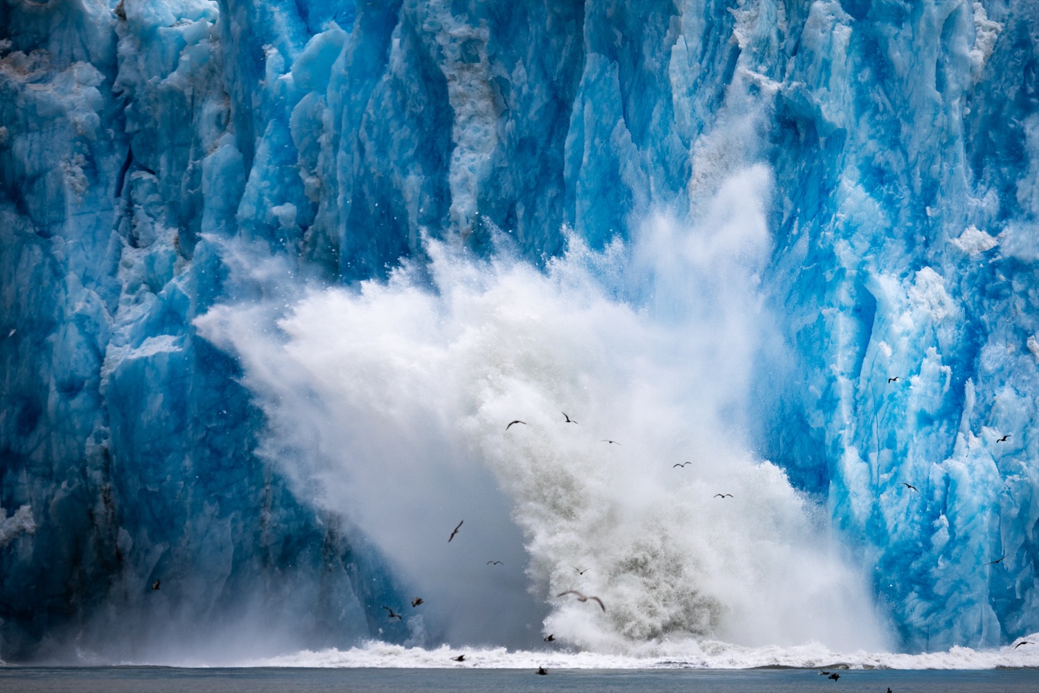 Glacier calving into the sea